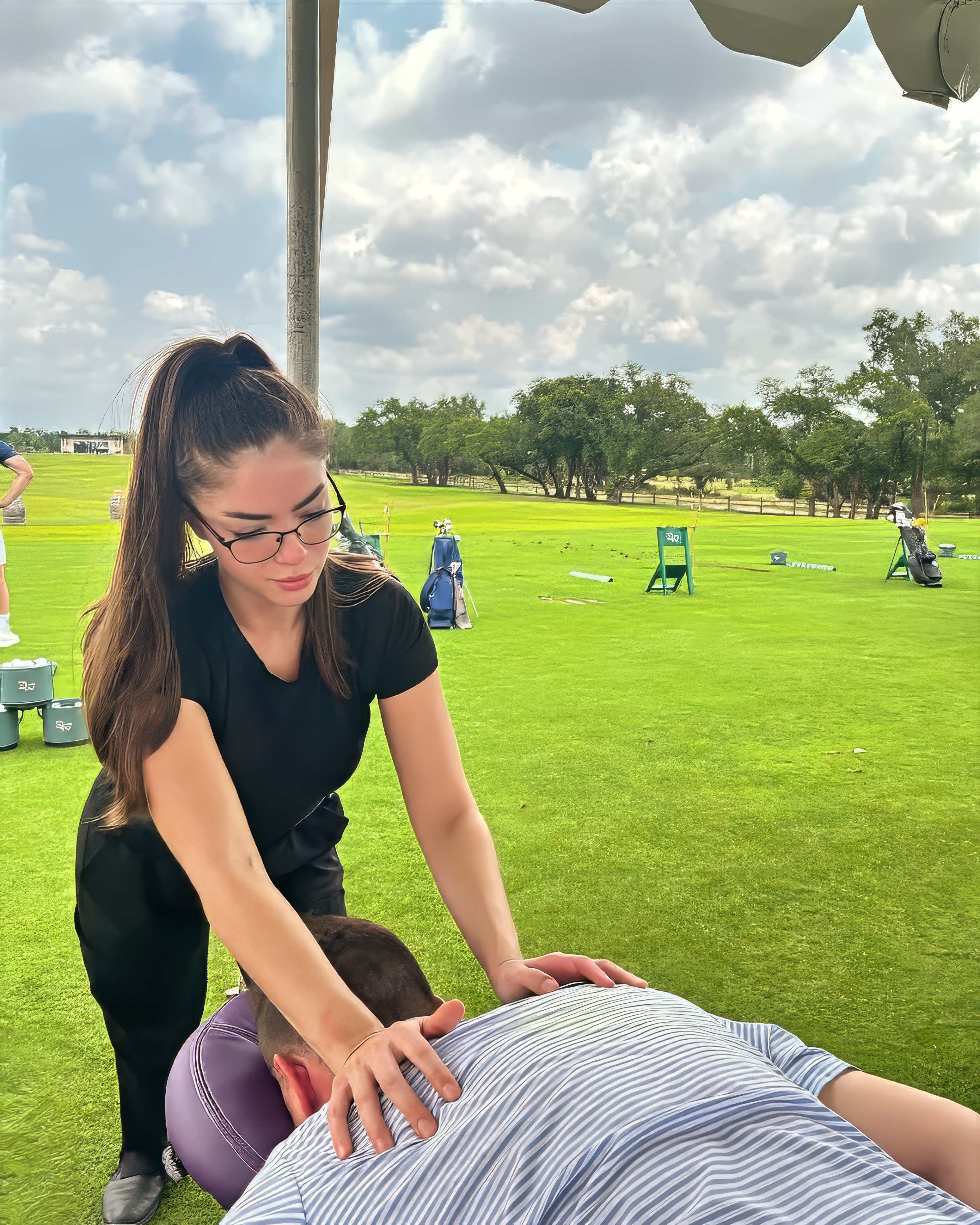 Jessica Treviño providing professional mobile massage therapy outdoors